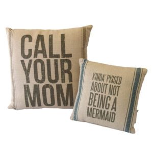 Two pillows that say call your mom about being a mermaid.