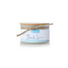 A jar with the word beach lotion on it.