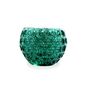 An emerald glass candle on a white background.