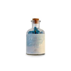 A Be Fearless Jar with blue matches