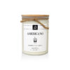 A white candle with a label.